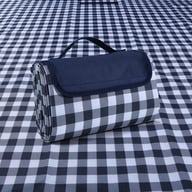 Folded moisture-proof picnic mat with navy carry handle on checkered background