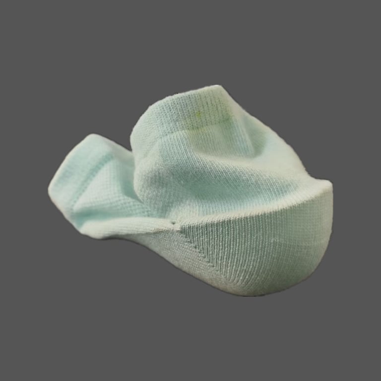 Black height-increasing sports socks on mannequin foot with loose pair displayed