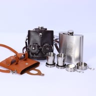 Leather flask sleeves with stainless steel flask and shoulder strap