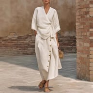 White linen casual two-piece set with wrap top and midi button skirt
