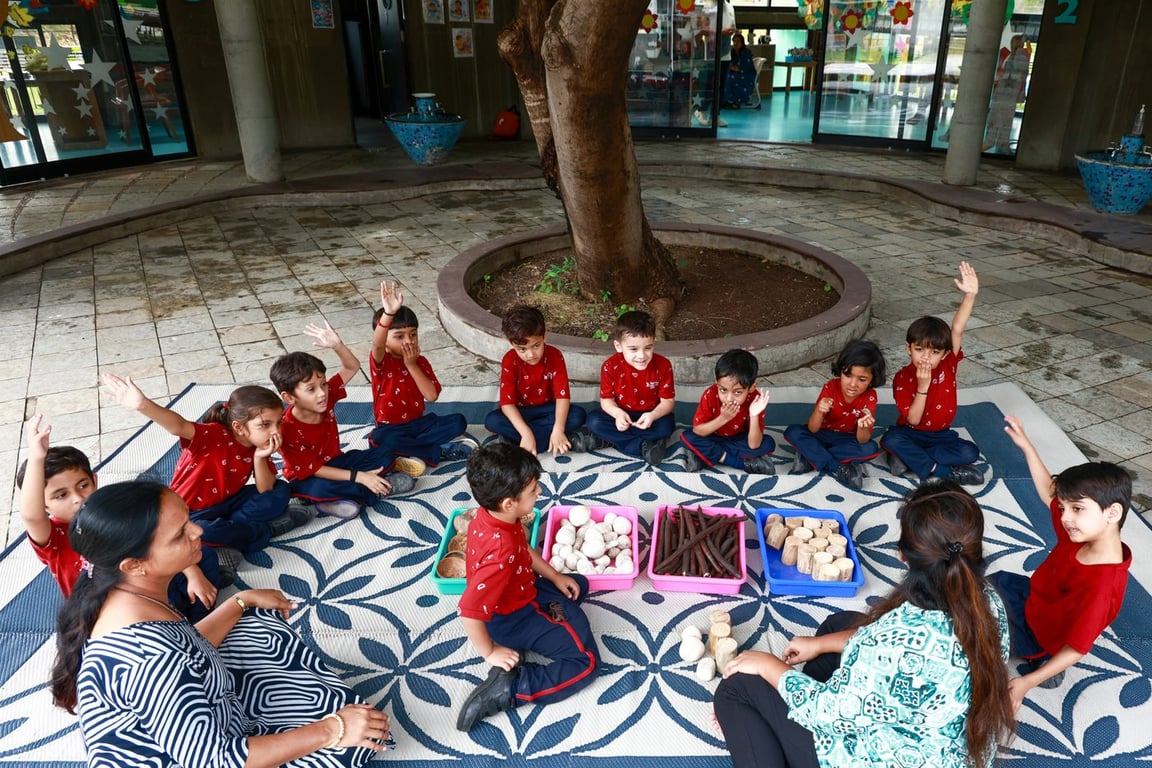 Early years activity circle around the courtyard tree