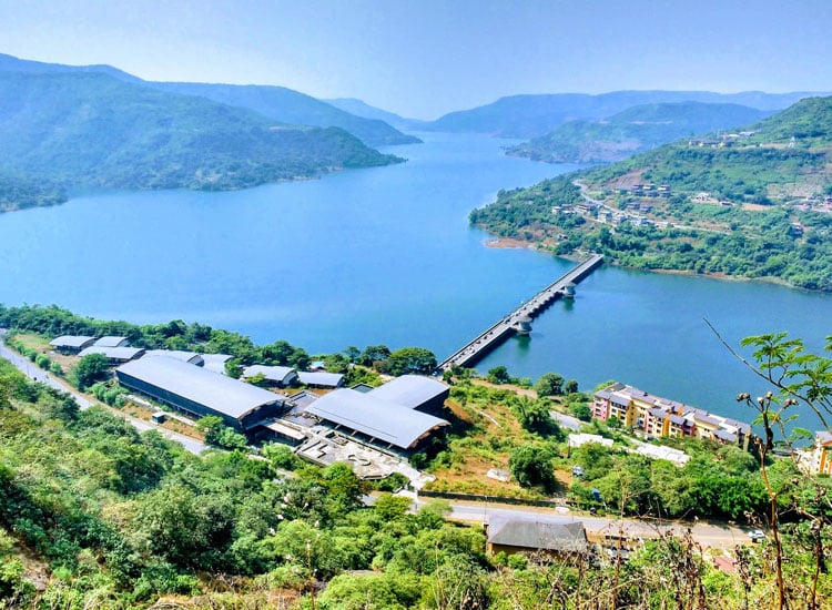 Colourful waterfront buildings and lake scenery in Lavasa