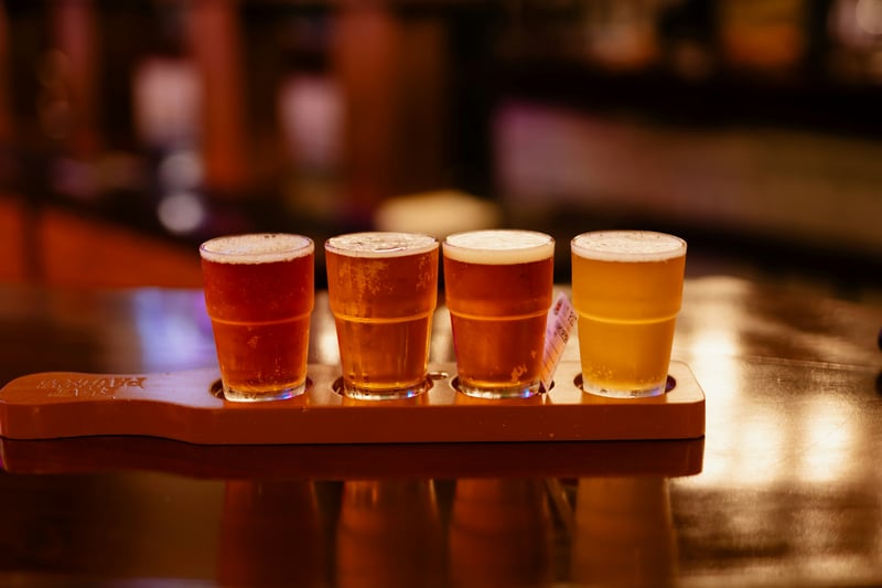 Illustrative image: a flight of beer glasses on a bar