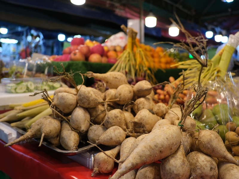 Illustrative image: fresh produce piled at a market stall