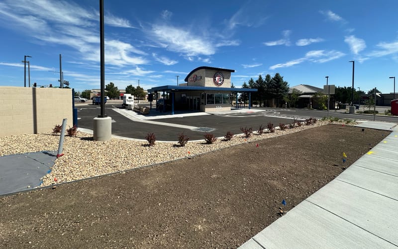 The 7 Brew Coffee drive-thru building at Castle Pines Parkway and Debbie Lane, signage installed and lot paved, before opening