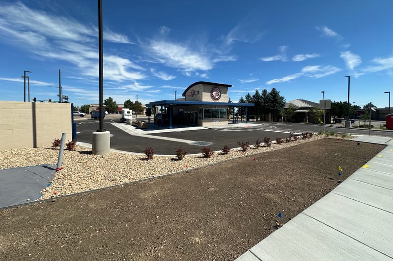The 7 Brew Coffee drive-thru building at Castle Pines Parkway and Debbie Lane, signage installed and lot paved, before opening