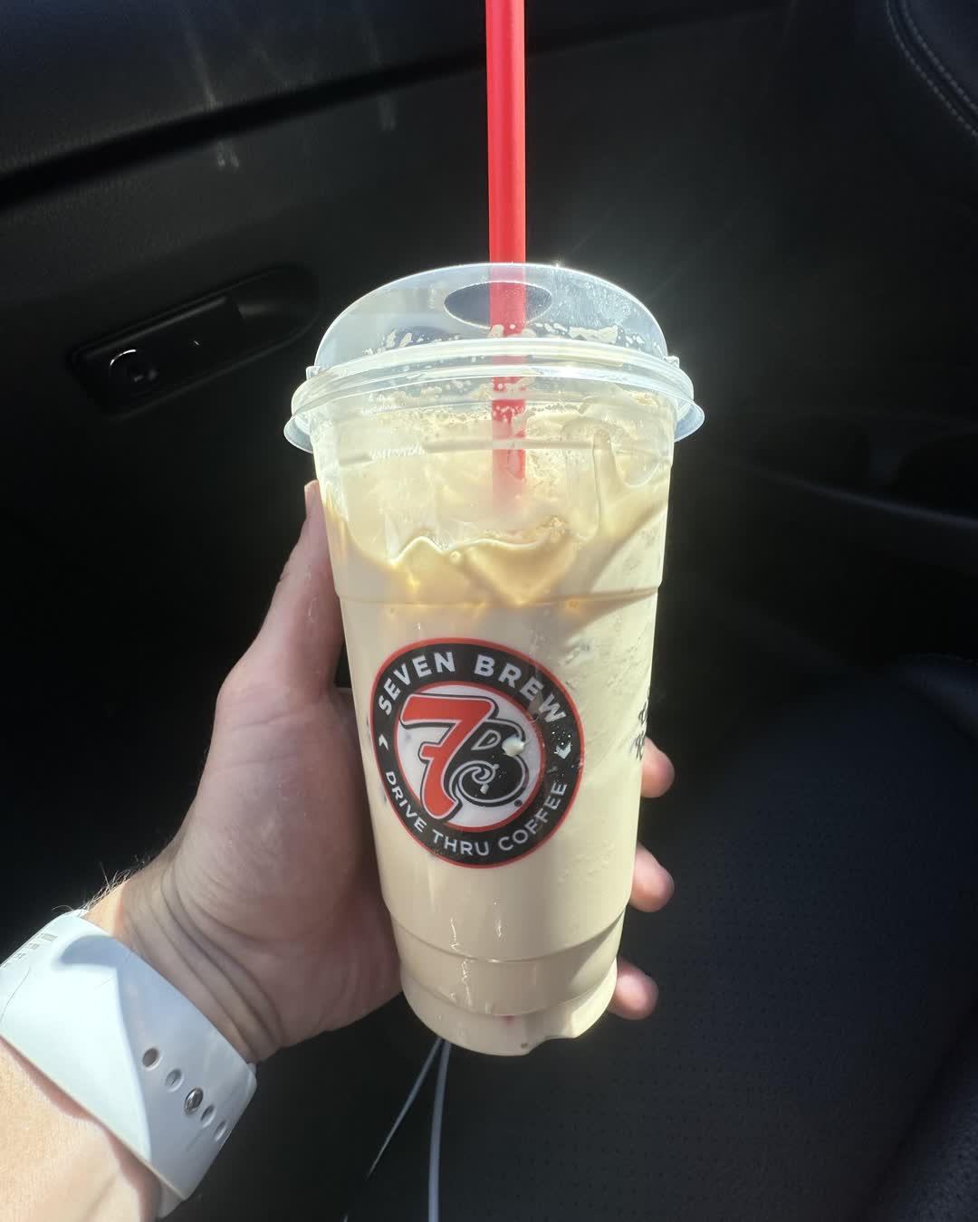 An iced drink from 7 Brew Castle Pines, the cup printed with the Seven Brew drive-thru coffee logo