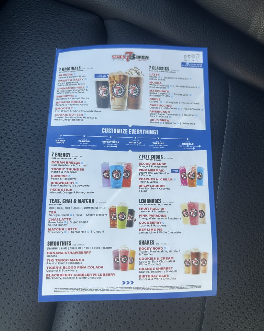 7 Brew's full drink menu board, listing 7 Originals, 7 Classics, 7 Energy, 7 Fizz Sodas, teas, lemonades, smoothies and shakes