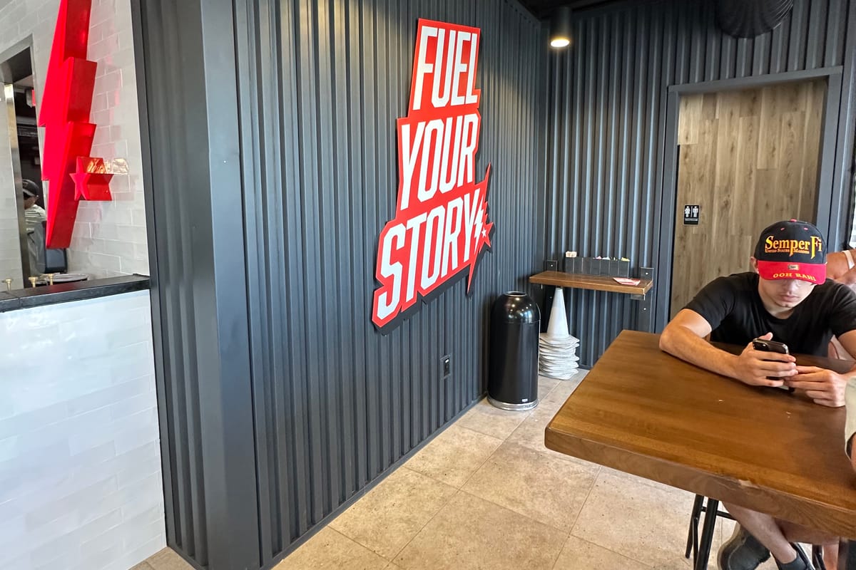 Fuel Your Story wall sign inside Black Rock Coffee at Parker Road and Stroh Road