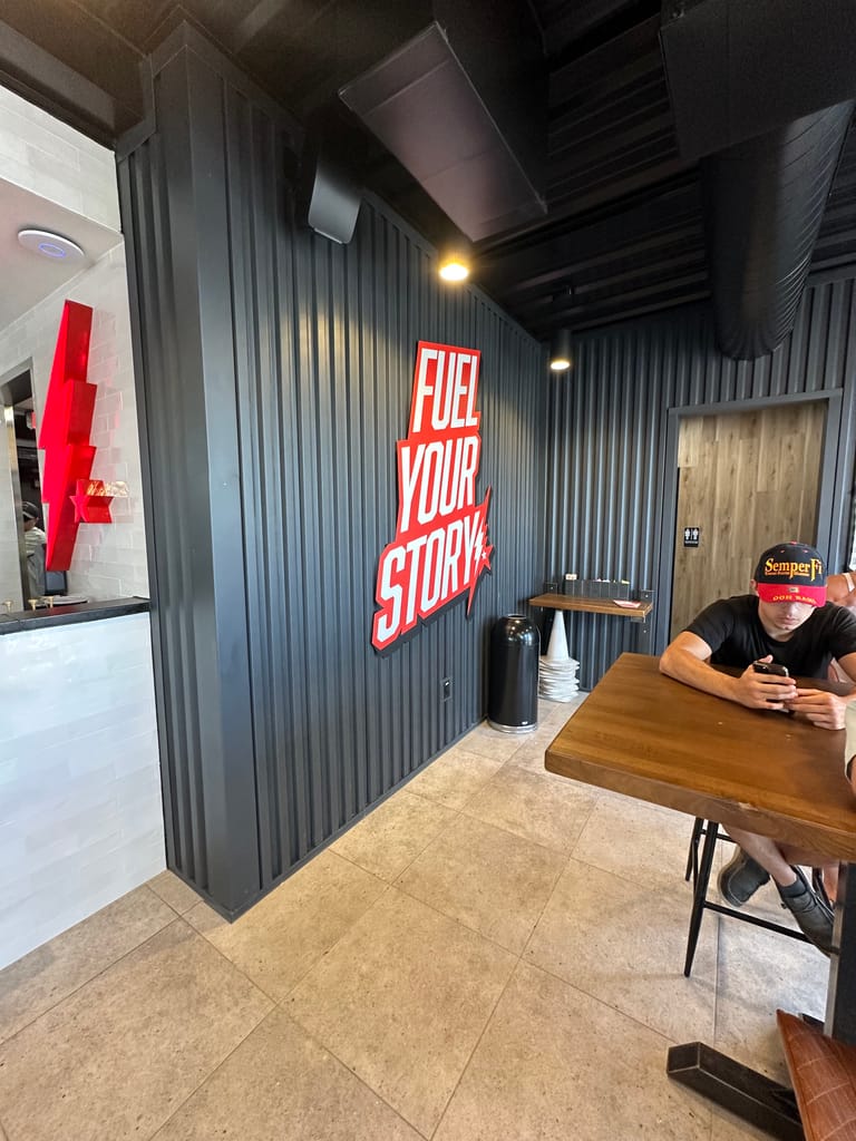 Fuel Your Story wall sign inside Black Rock Coffee at Parker Road and Stroh Road