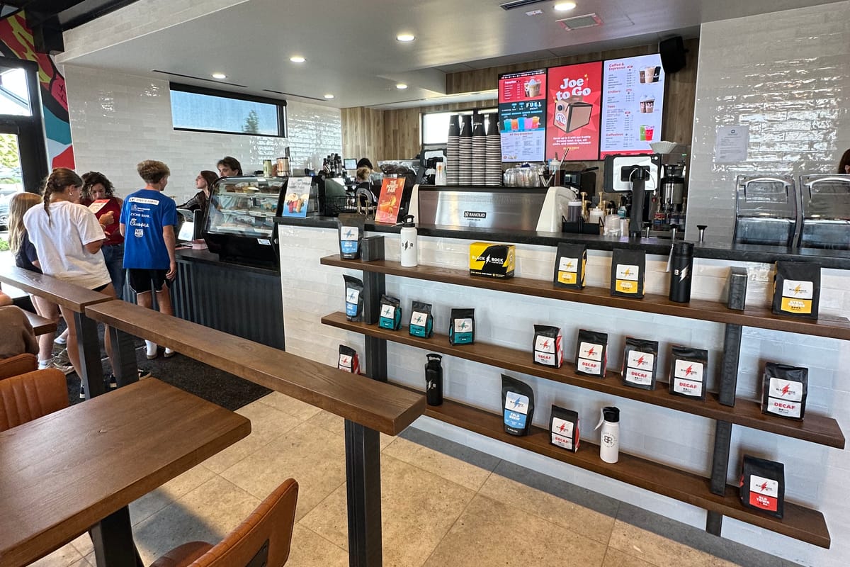 Order counter and bagged coffee shelves at Black Rock Coffee on Stroh Road in Parker