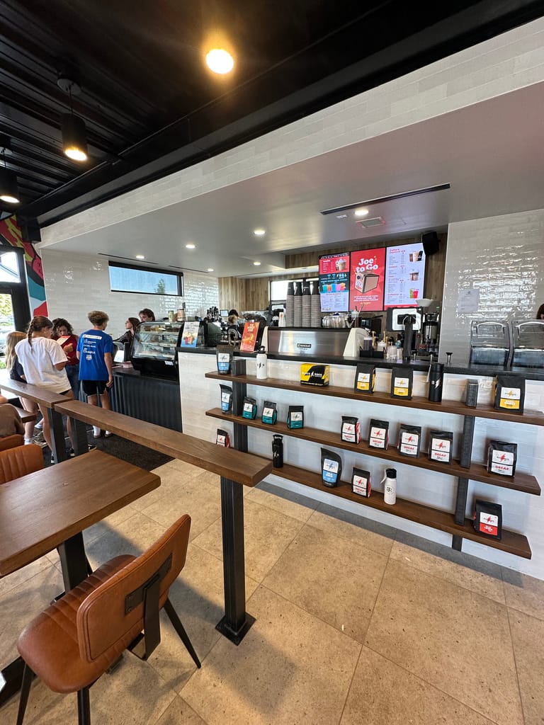 Order counter and bagged coffee shelves at Black Rock Coffee on Stroh Road in Parker