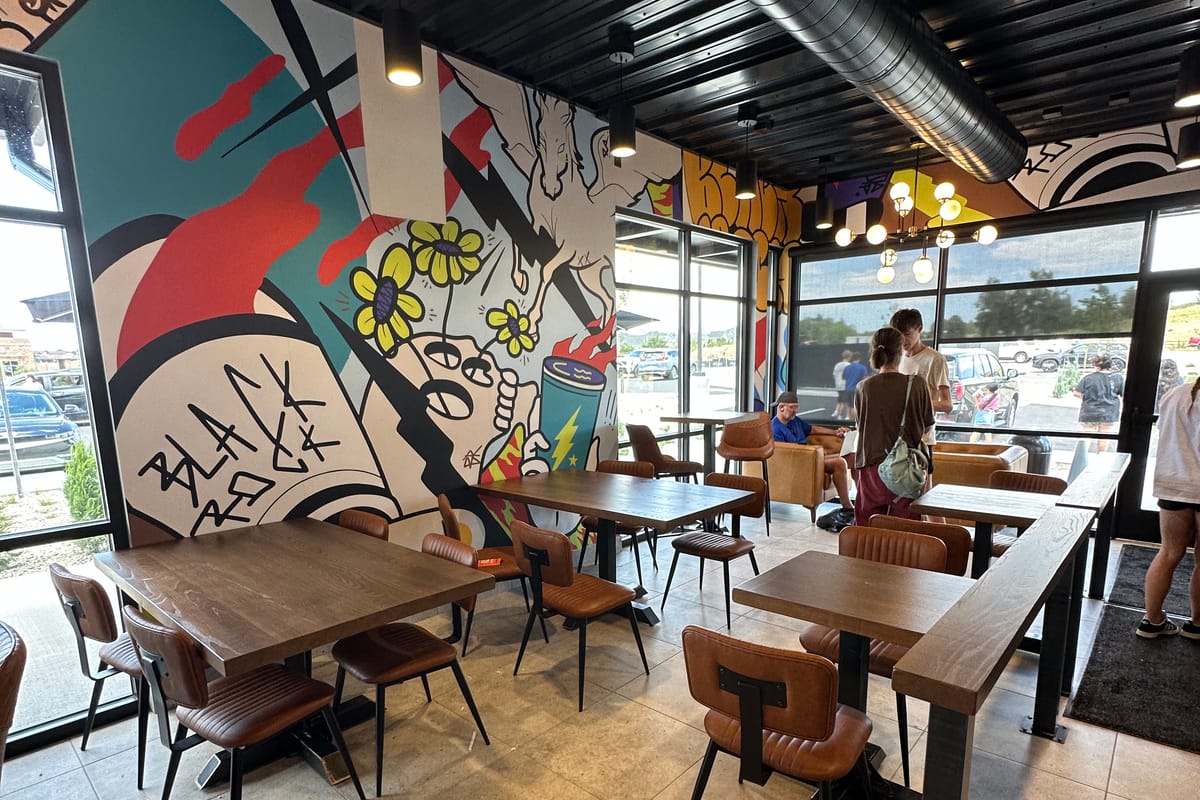 Indoor seating and Black Rock mural at the Stroh Road Black Rock Coffee in Parker