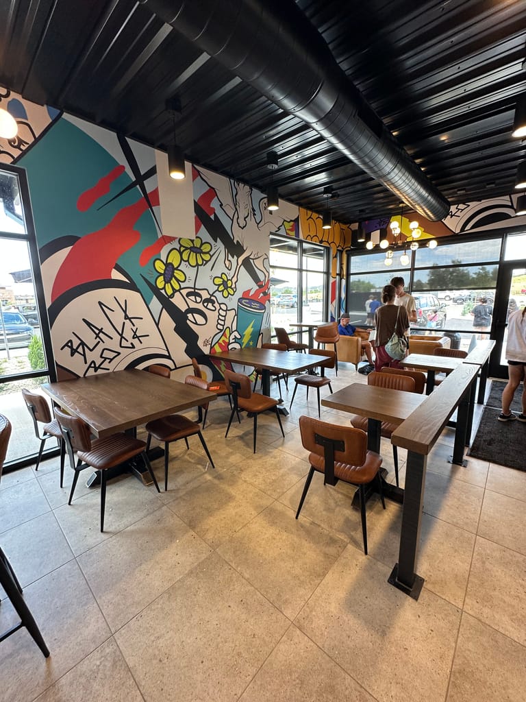 Indoor seating and Black Rock mural at the Stroh Road Black Rock Coffee in Parker