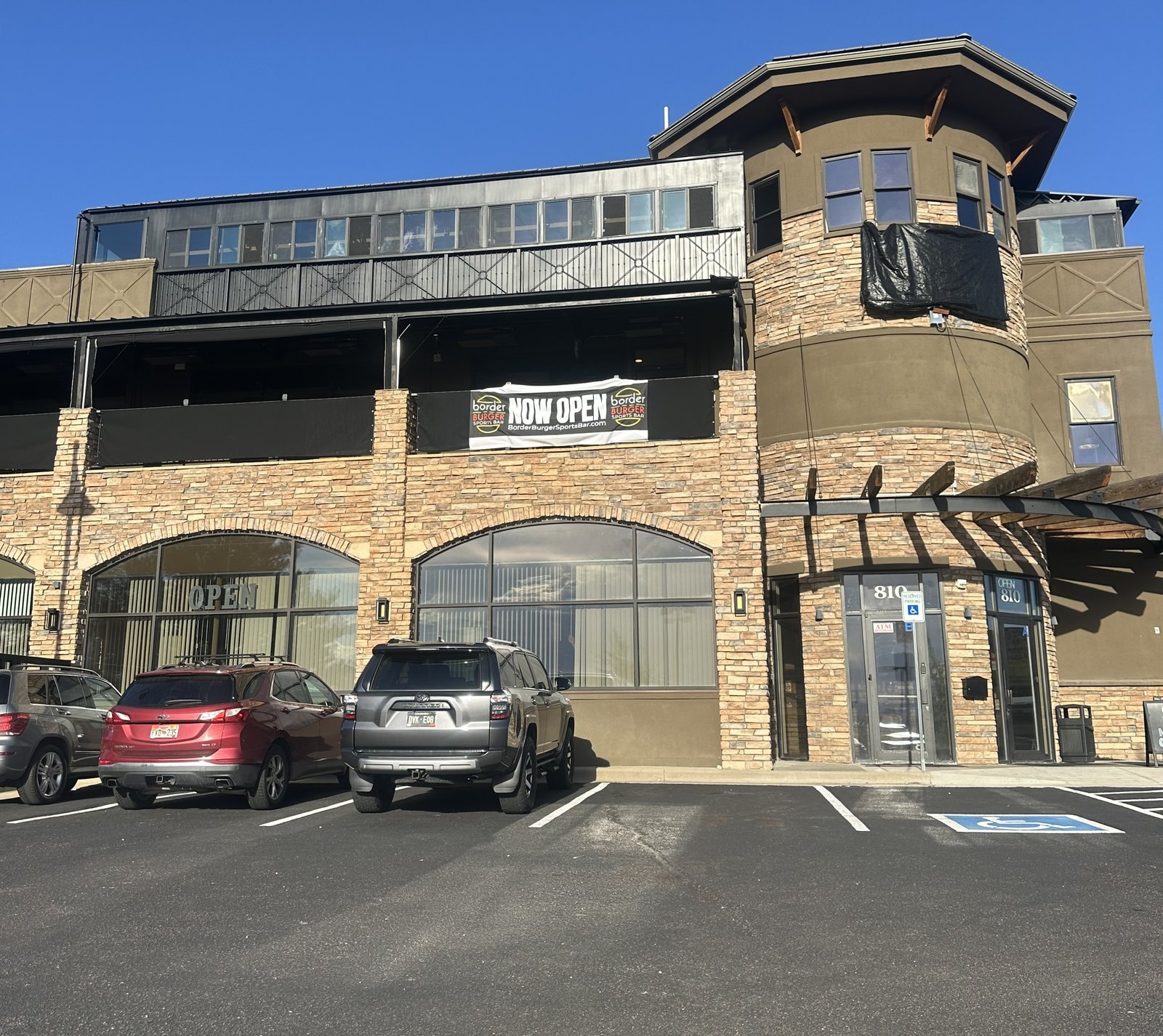 The Border Burger Sports Bar building at 810 New Memphis Ct with a temporary Now Open banner