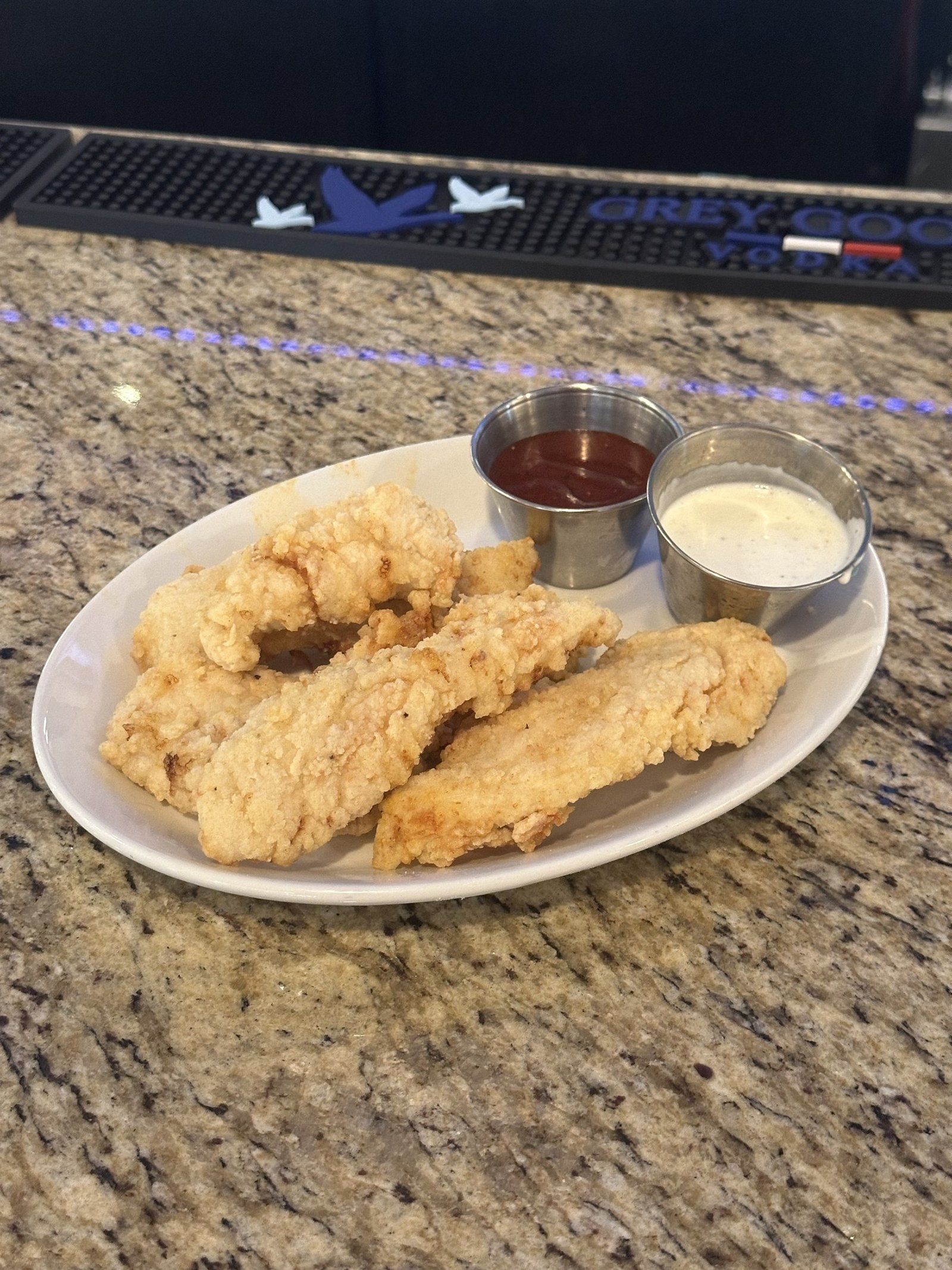 Red Bird chicken strips with BBQ and ranch at Border Burger Sports Bar
