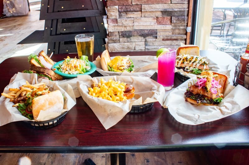 Burgers, tacos and drinks on a table at Border Burger Sports Bar