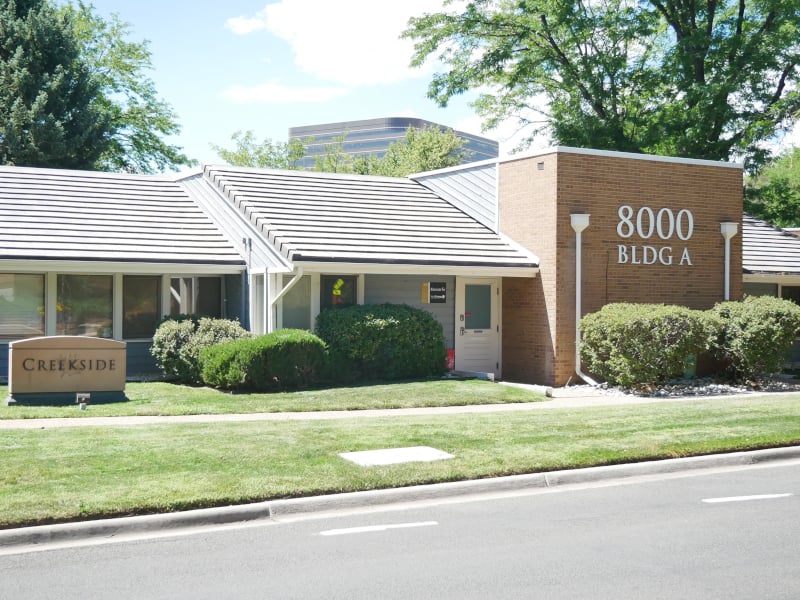 The 8000 Building A entrance at the Creekside office park, home of Buka Yoga's DTC studio in Greenwood Village