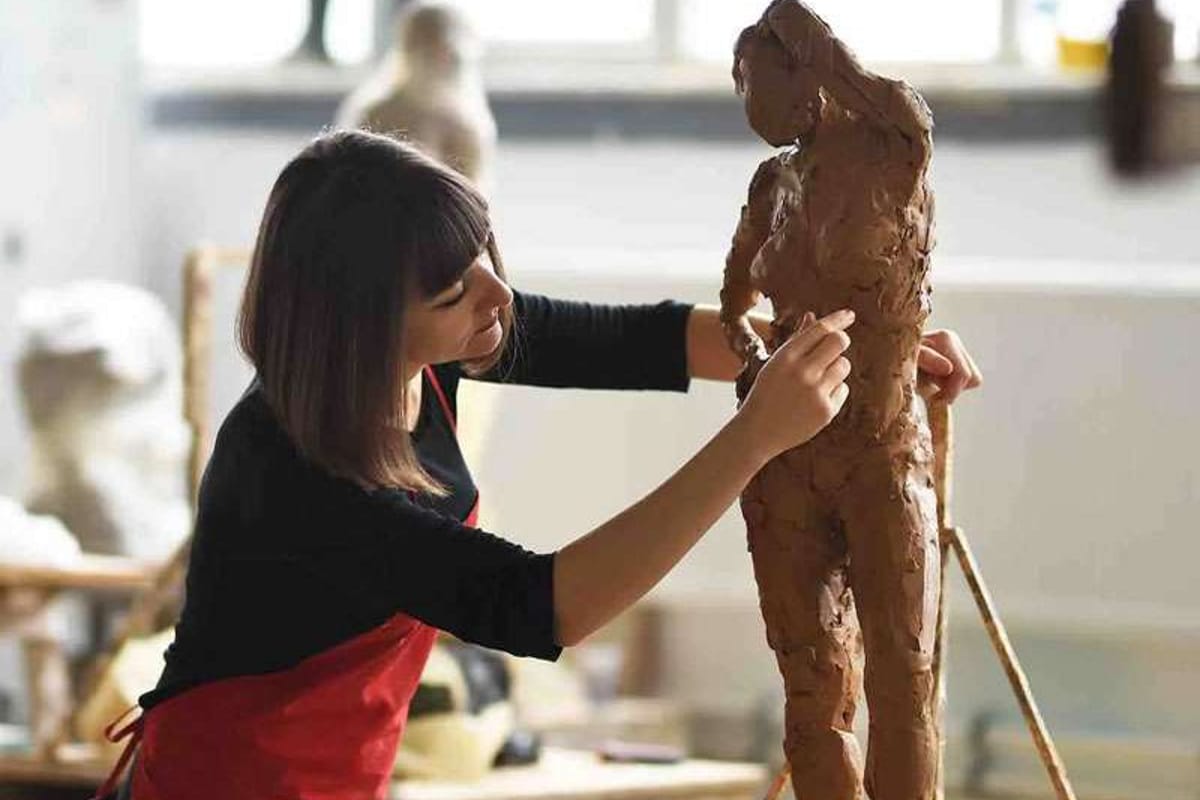 Woman sculpting in a 3D art class at Tri Arts Project