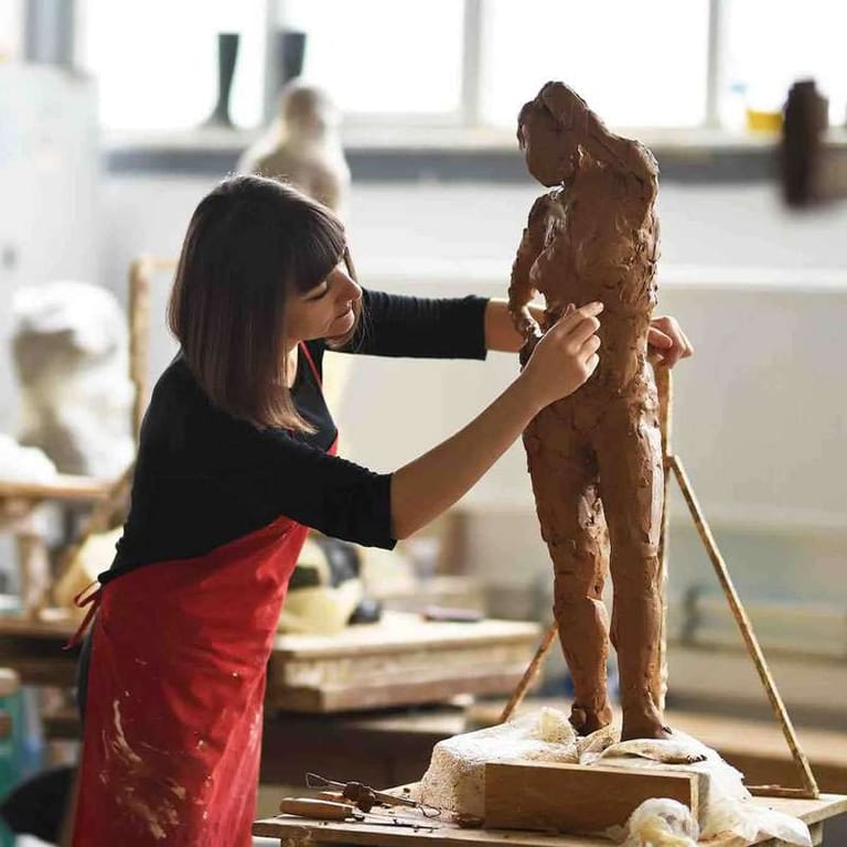 Woman sculpting in a 3D art class at Tri Arts Project