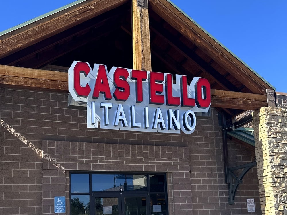 The Castello Italiano sign above the entrance at 361 Village Square Ln in Castle Pines