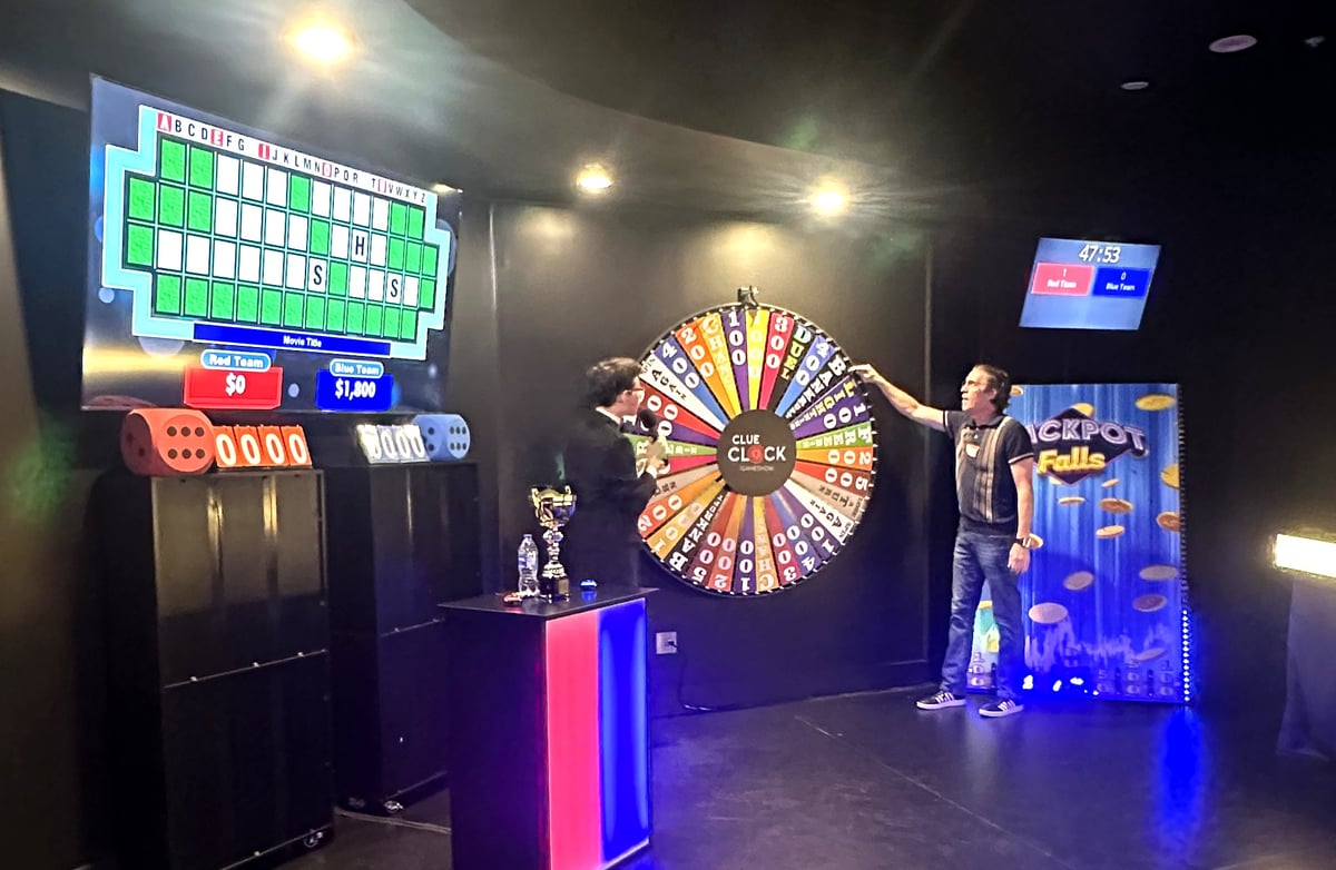 Spinning the wheel on Spin To Win, with the Jackpot Falls board to the right