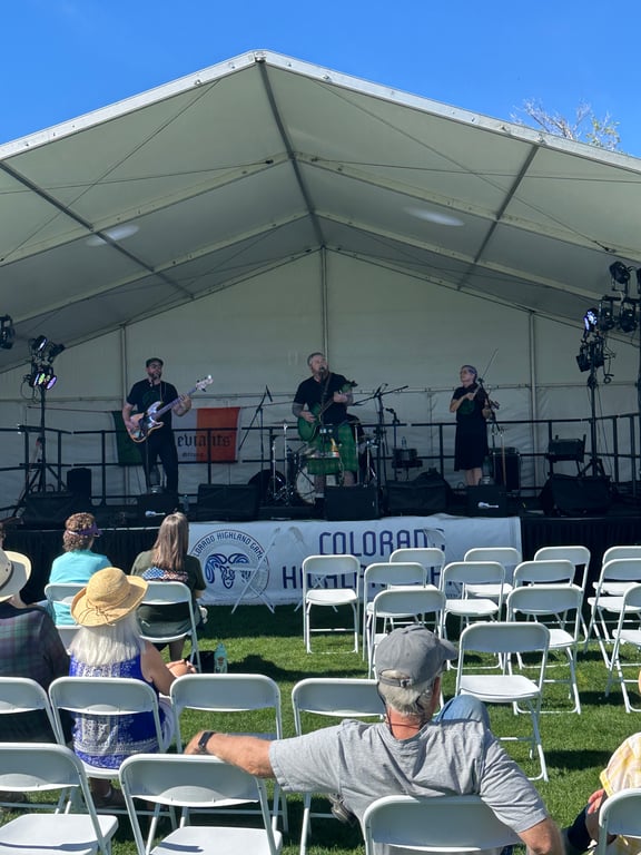 A band playing on the main stage under the big tent at the Colorado Highland Games