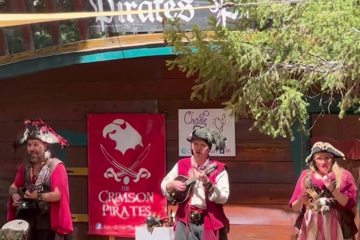 The Crimson Pirates musical act performing at the Pirate's Pub stage at the Colorado Renaissance Festival