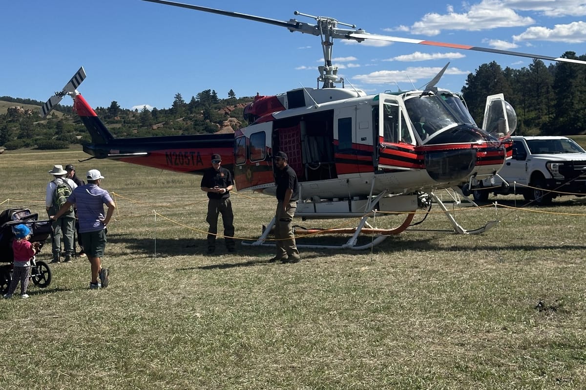 Douglas County’s firefighting helicopter parked in the meadow at Sandstone Ranch