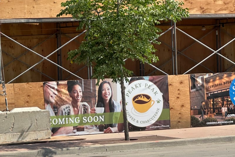 Peaky Peak Coffee & Charcuterie coming-soon banner at Parker's East Main development