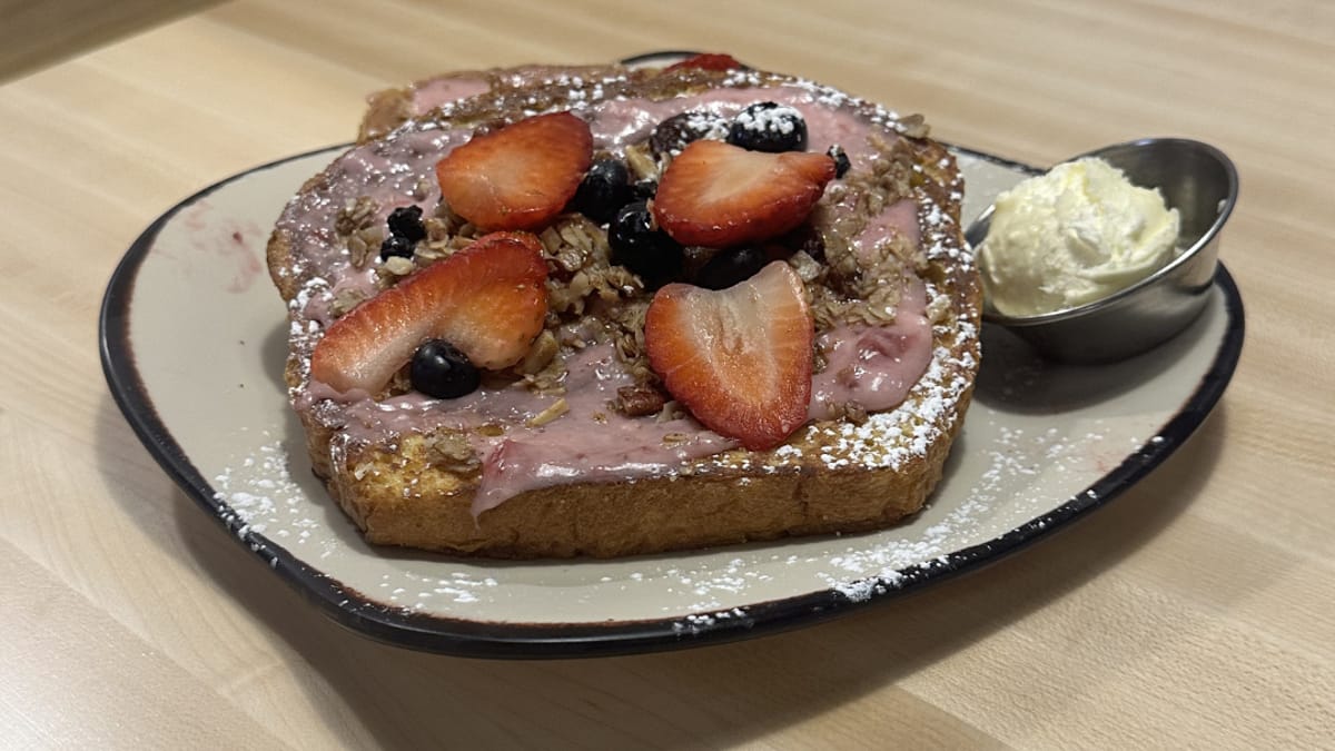 Egg Harbor Cafe's berry-topped French toast, photographed at the Highlands Ranch location — a second Colorado spot is coming to Belleview Station in Denver