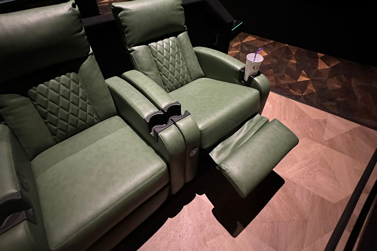 Heated recliners in a row at Emagine Parker with quilted leather and warm wood-paneled walls.