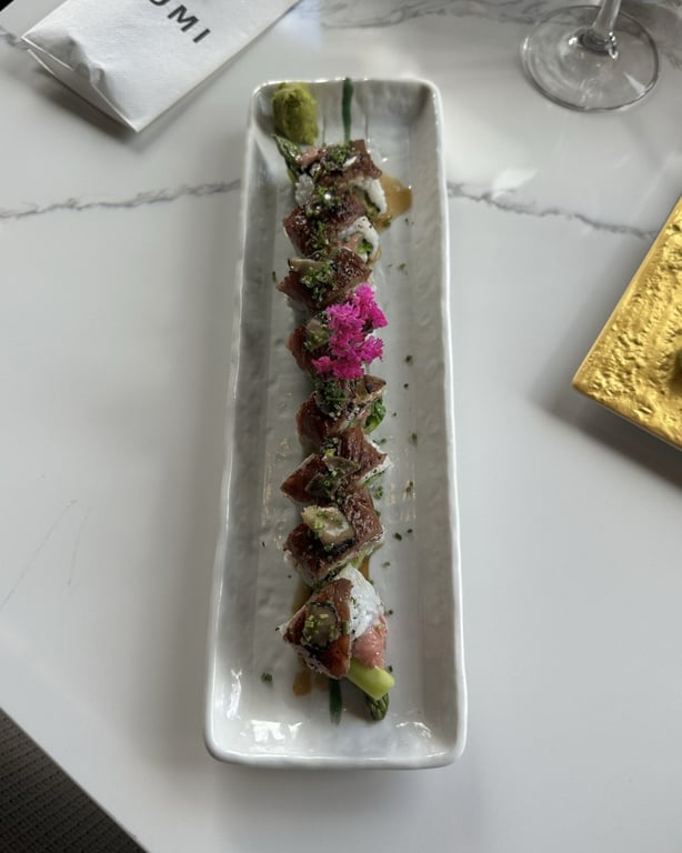 Kobe Beef Truffle Roll on long white plate at Izumi Sushi in downtown Castle Rock