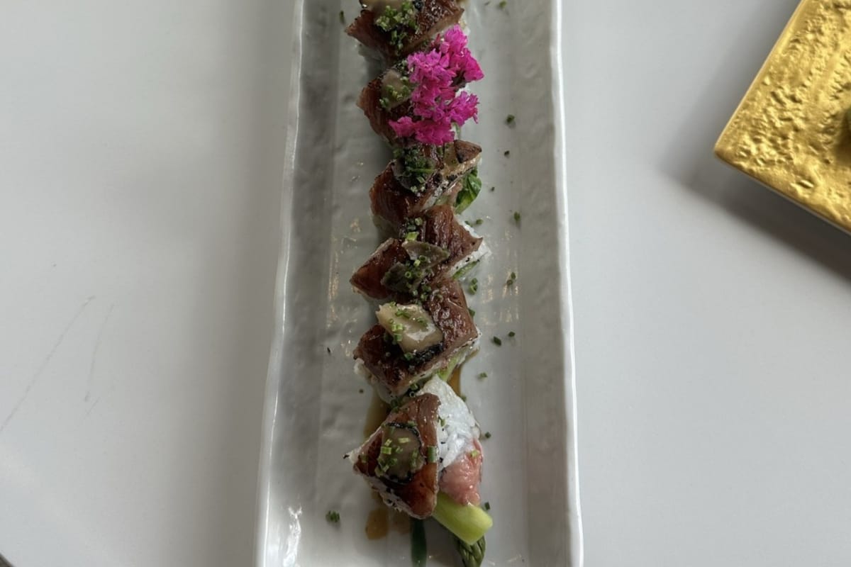 Kobe Beef Truffle Roll on long white plate at Izumi Sushi