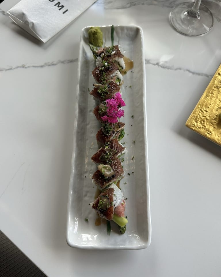 Kobe Beef Truffle Roll on long white plate at Izumi Sushi