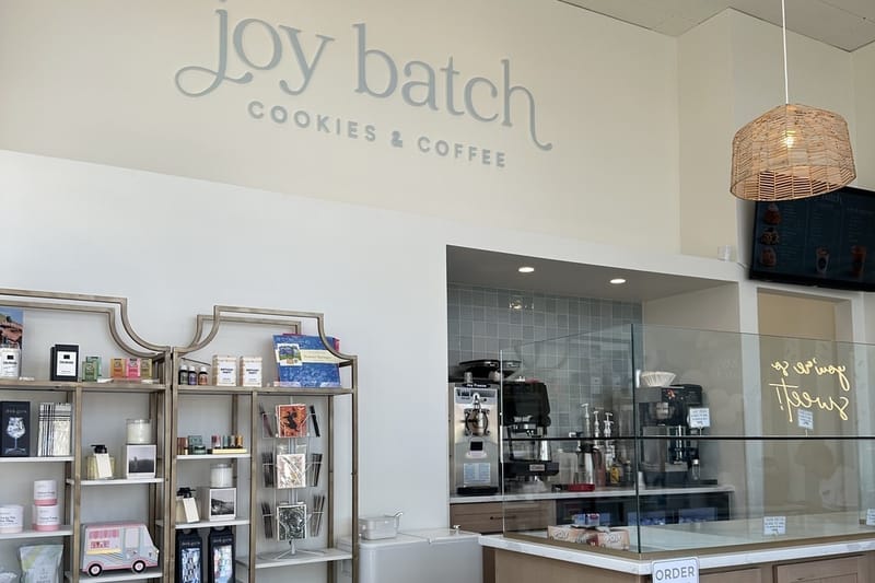 The logo wall and counter inside Joy Batch Cookies & Coffee in Highlands Ranch