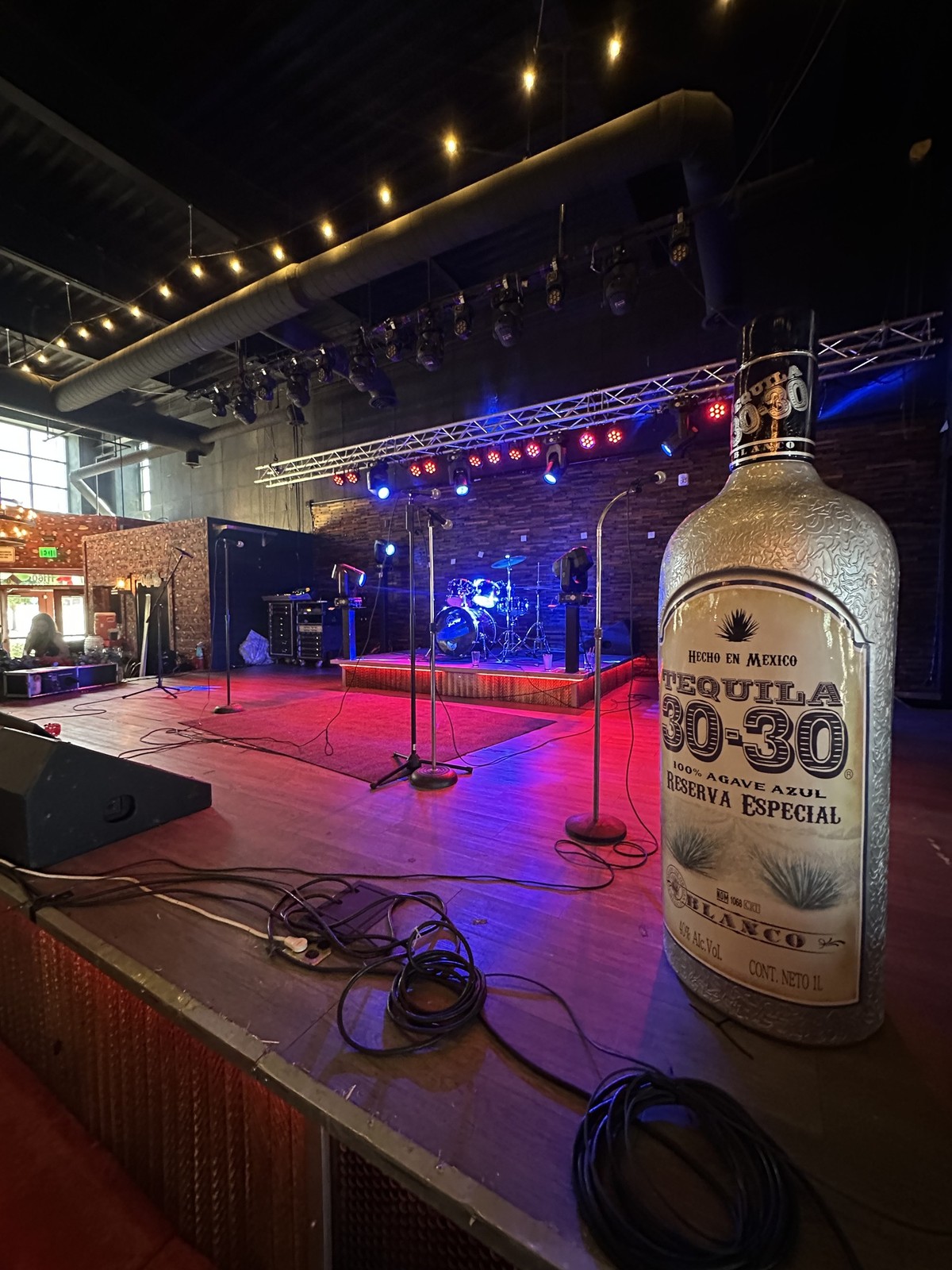 The indoor stage — drum kit, lighting rig and monitors, set up on opening day