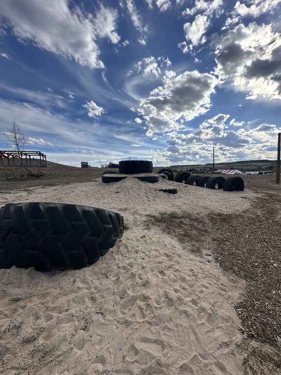 Tire Mountain, a sand hill with giant tractor tires at Lone Creek Farms