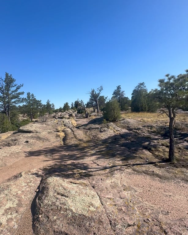 Flat slickrock and open sky on the Echoes of Ancestors Trail at Lost Canyon Ranch Open Space, Castle Rock