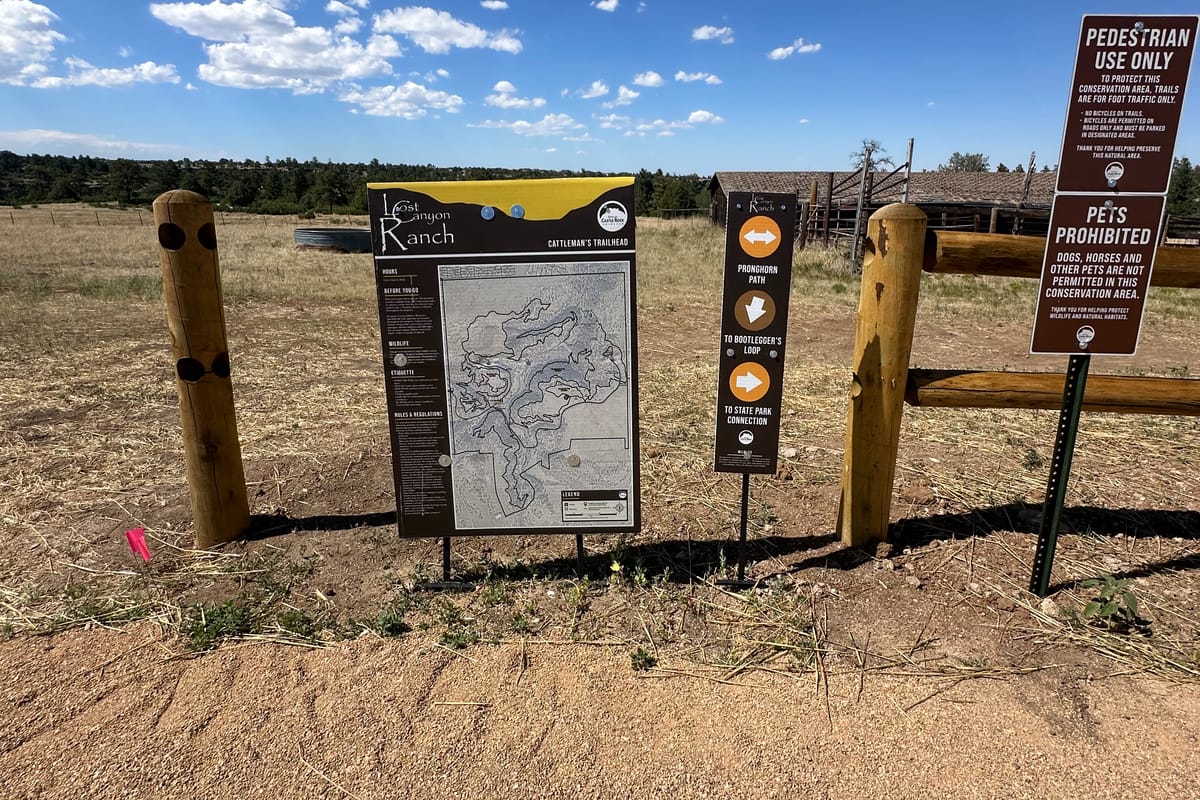 The Cattleman's Trailhead map board and rule signs at Lost Canyon Ranch Open Space, Castle Rock, showing the trail map and the Pedestrian Use Only and Pets Prohibited signs