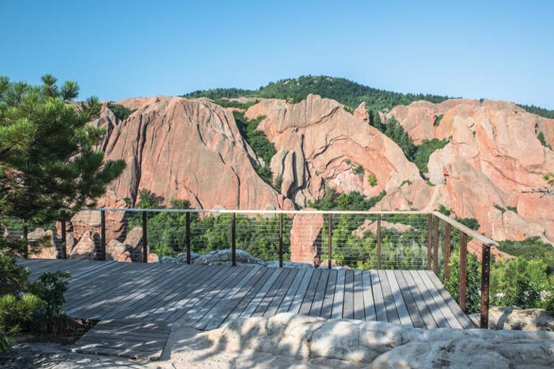 Viewing deck at Lyons Overlook among red rock formations in Roxborough State Park