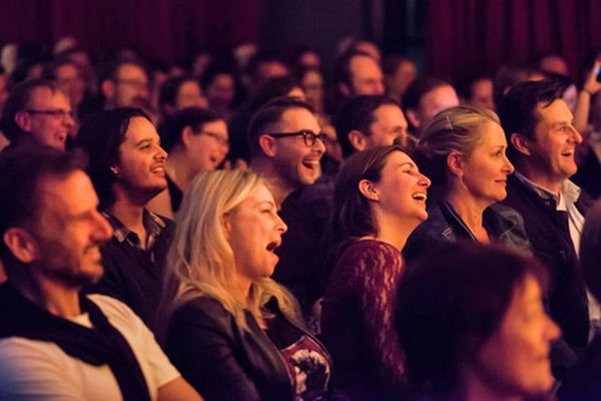 A full house of guests enjoying a performance at Magic Manor