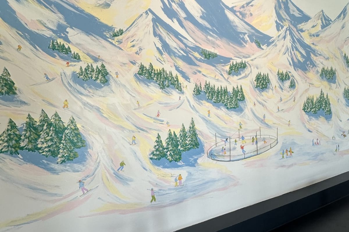 Close-up of the hand-painted mountain mural in the loft area at Monk & Mongoose High Note