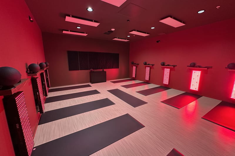 Wide view of the Glow infrared-heated, red light mat studio at Nova Glow in Parker, Colorado