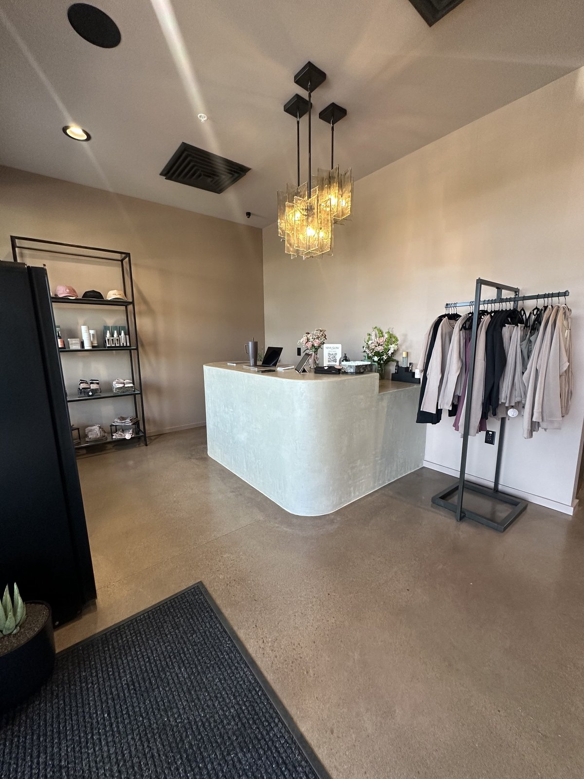 The front desk and shop at Nova Glow Studio in Parker
