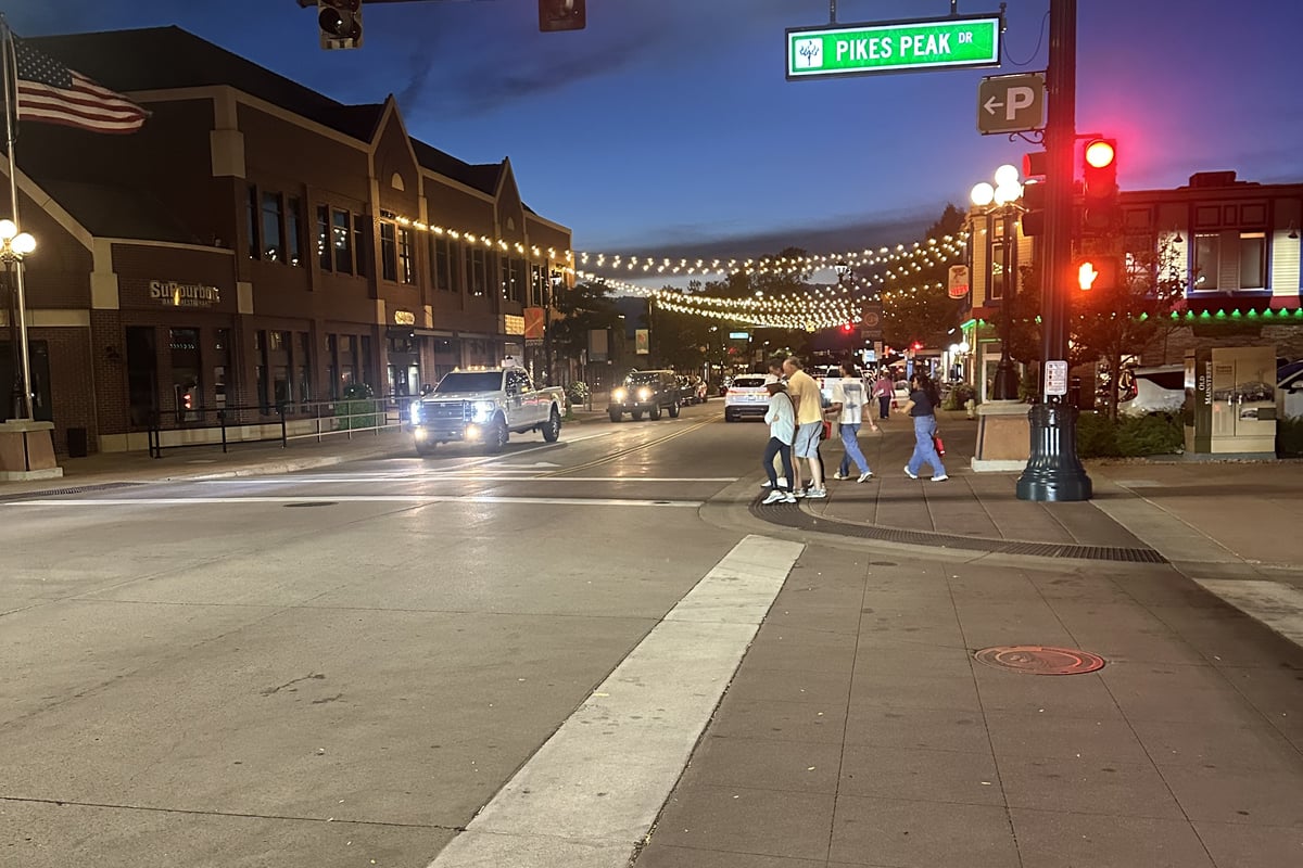 Mainstreet in downtown Parker at dusk under the festoon lights at the Pikes Peak Drive intersection