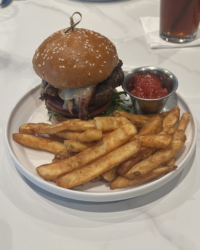 1902 Burger with pork belly and sweet ketchup at Champagne Velvet Proper Kitchen & Bar