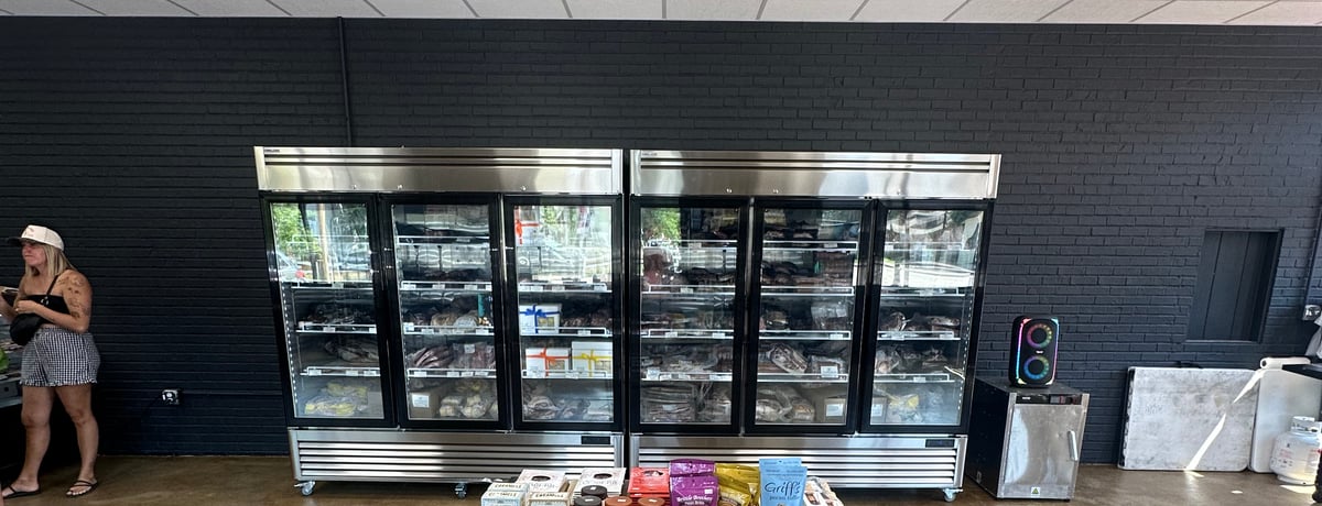 Butcher cases of local beef and cuts at a Douglas County meat market