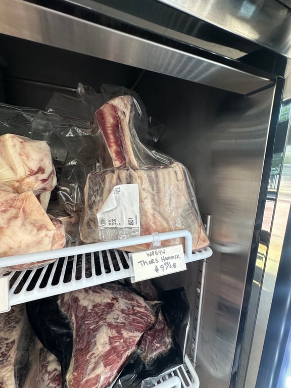 The "Wagyu Thor's Hammer," a huge frenched beef shank, in the display case at Rugby Scott in downtown Parker