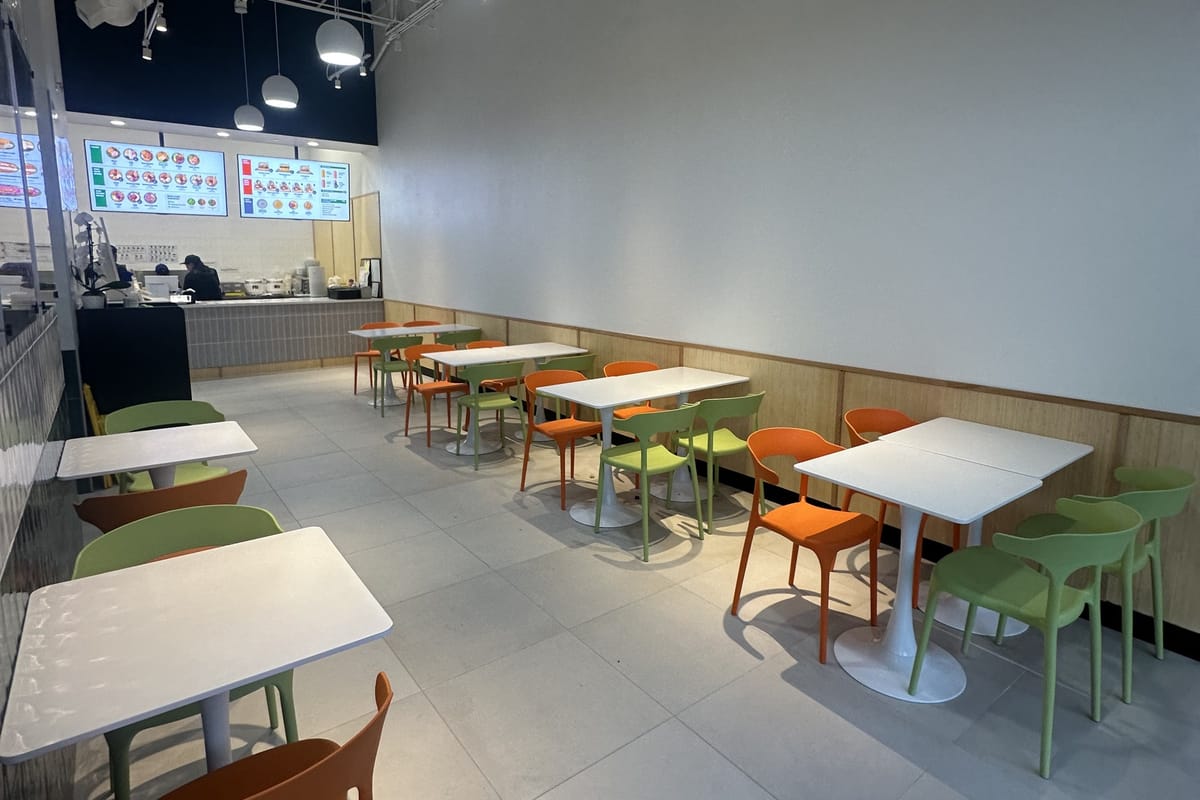 The dining room at Salady Parker with orange and green seating